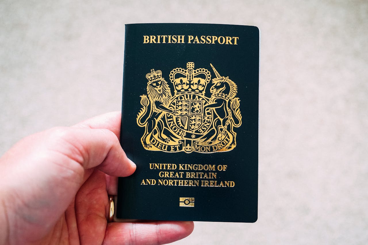 Crop unrecognizable person demonstrating British passport